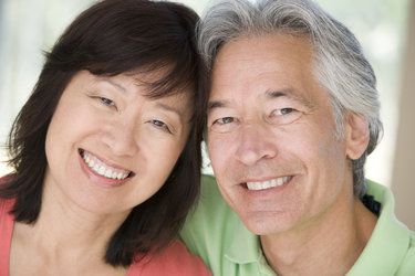 Happy couple shows off their bright smiles