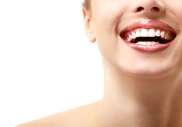 A middle-aged couple share bright smiles